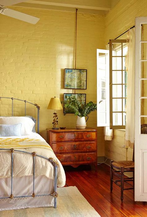 Restoration of Eclectic French Quarter Pied-a-Terre in New Orleans French Door Interior, Old French Doors, French Country Rug, Country Style Bedroom, Casa Country, Door Interior, Yellow Bedroom, Exposed Brick Walls, Yellow Walls