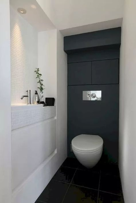 a black and white contemporary powder room with a built in sink, some built in lights and even storage Drømme Bad, Toilet Closet, Small Bathroom Remodel Designs, Toilette Design, Toilet Ideas, Bilik Air, Small Toilet Room, Guest Toilet, Downstairs Loo