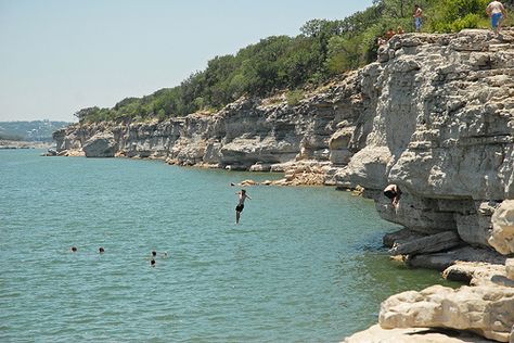 Cliff diving at Pace Bend Park Approximately 30 miles west of Austin on Lake Travis, the north and east side of the park have shallow beaches perfect for children and dogs. Admission is $10 per car. (2011 Pace Bend Rd N)