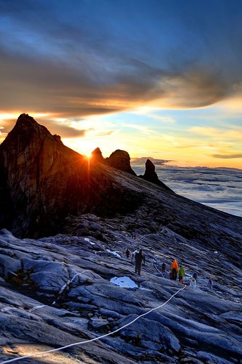 Mount Kinabalu is the highest mountain in Malaysia. The mountain is part of Kinabalu Park, one of the oldest national parks in Malaysia and a UNESCO World Heritage Site. Mount Kinabalu is a major destination for climbers and they love to enjoy impressive trails that allow a glimpse of the picturesque surroundings of the region. The Mountain has a unique ecosystem of alpine meadows, grasslands, and shrublands and is home to impressive flora and fauna. One of the best places to visit in Malaysia. Mount Kinabalu Wallpaper, Places To Visit In Malaysia, Kinabalu Park, Malaysia Itinerary, Mount Kinabalu, Beautiful Eyes Color, Camping Life, Beautiful Mountains, Best Places To Visit