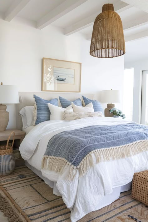 I love coastal bedroom decor for its ability to create a serene and inviting atmosphere. The light, airy color scheme and use of natural materials like wood and rattan give the space a relaxed and comfortable feel. The incorporation of beach-inspired elements such as seashells, driftwood, and ocean-themed artwork adds a touch of whimsy and nostalgia, reminding me of cherished moments spent by the shore. California Coastal Interior Design Bedroom, Beachy Bedroom Aesthetic Bohemian, Beach House Bedroom Decor, Light Blue Boho Bedroom, Blue Boho Bedroom Ideas, Beachy Bedrooms, Blue Boho Bedroom, Blue Themed Bedroom, Coastal Farmhouse Bedroom