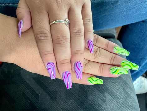 Neon Green And Purple Nails Design, Purple Swirls Nails, Green Purple And White Nails, Blue Purple And Green Nails, Purple Rave Nails, Neon Purple Nail Designs, Green And Purple Acrylic Nails, Purple Green Nails Designs, Neon Purple And Green Nails