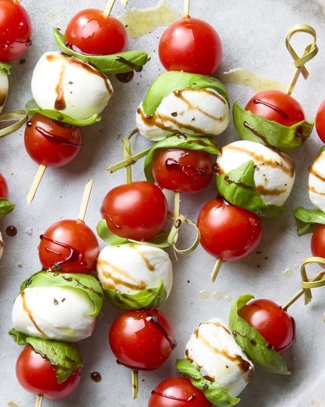 Caprese Skewers Recipe (with Balsamic Glaze) | The Kitchn Light Bites For Party, Mini Caprese Skewers, Caprese Appetizer Bites, Tomato And Mozzarella Appetizer, Party Skewers Appetizers, Skewer Snacks, Caprese Skewers Appetizers, Host Recipes, Caprese Cups