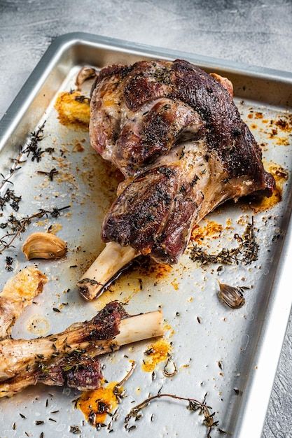 Photo roasted lamb mutton whole leg in a... | Premium Photo #Freepik #photo #grilled-meat #roast #cooked-meat #meat-plate Roasted Lamb, Lamb Roast, Baking Dish, Top View, Premium Photo, Baked Dishes, White Background, Grilling, Meat