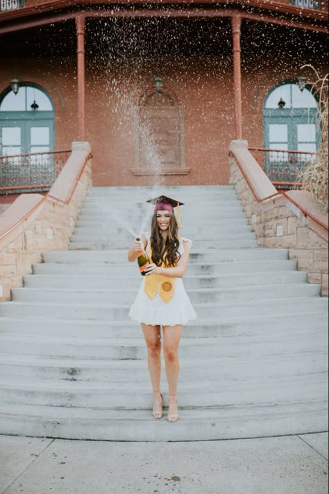 Senior graduation photo spraying champagne to celebrate!  #graduation #graduationpictures #champagne #celebration #party #grad #seniorportraits #seniorphotos Masters Graduation Pictures, Champagne Spray, Nursing School Graduation Pictures, College Grad Pictures, College Grad Pics, Champagne Celebration, Grad Picture Ideas, College Grad Photos, Graduation Pictures Poses