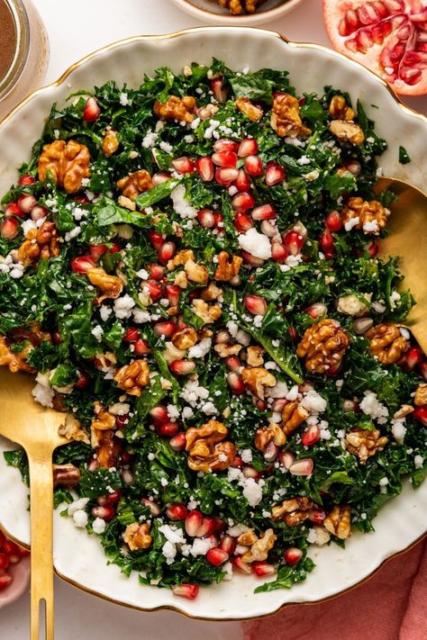 This kale pomegranate salad (aka Christmas Salad) is super easy to whip up and makes for a festive and healthy option for the holidays. Fig Pomegranate Salad, Healthy Salad Recipes For Christmas, Winter Salad Pomegranate Goat Cheese, Spinach Salad Christmas, Winter Salad Vegetarian, Holiday Kale Salad, Green Salad Christmas, Winter Pomegranate Salad, Pomegranate Food Ideas