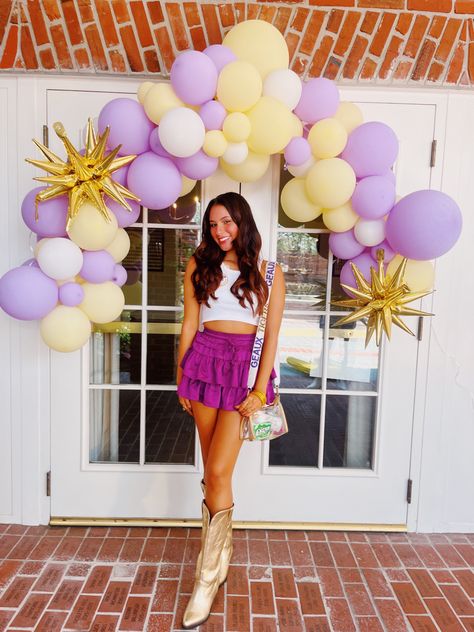 lsu football game day tailgate outfit college sorority fashion Lsu Baseball Game Outfit, Lsu Themed Graduation Party, Lsu Tailgate Outfit, Lsu Graduation Party, Purple And Gold Game Day Outfits, Lsu Grad Party, Purple And Yellow Gameday Outfit, Purple Game Day Outfit, Lsu Game Day Outfit Tailgating