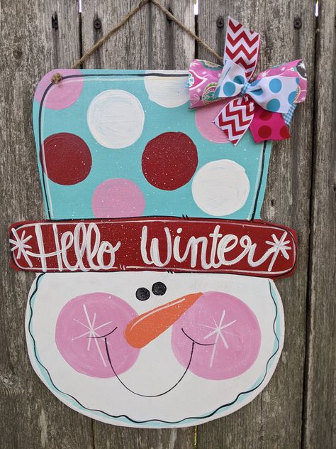 "Y'all just check out this adorable winter snowman door hanger.!! Is this not the cutest??!! And I'll be glad to customize this for you. Just Convo me please. Hand painted on 5 mm thick wood and varnished for protection. Jute hanger and ribbon accent. 18\" tall x 14\" wide." Winter Signs Wooden, Winter Door Hanger, Snowman Door Hanger, Door Hanger Christmas, Valentines Door Hanger, Snowman Door, Snowman Sign, Wood Door Hanger, Wood Snowman