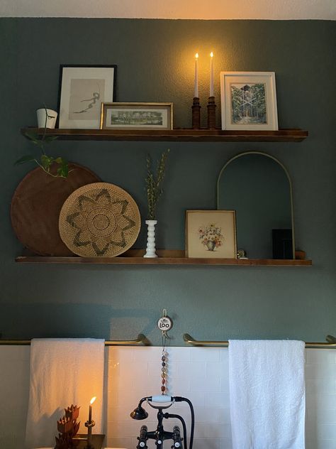 Photo Ledge With Mirror, Floating Shelves With Artwork, Picture Shelf Kitchen, Picture Ledge Shelf Decor, Bathroom Floor Shelf Decor, Small Ledge Decor, Kitchen Picture Ledge, Picture Ledge In Bathroom, Dining Room Picture Ledge