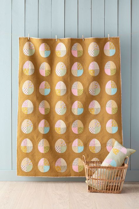 *This pretty quilt has a simple layout but the plump curves of the Easter eggs bring great charm to the design. It's also a good quilt to practice sewing curves and useful diagrams are supplied to help you master this technique. The pastel spring colours of the Creating Memories fabric collection are complemented beautifully by the mustard Chambray background, which is as warm as liquid caramel-perfect for Easter. *quilt finishes at 56.5 x 72.5" *This kit includes all fabric required as per the Easter Egg Quilt, Liquid Caramel, Easter Quilt, Simple Layout, Easter Garland, Spring Colours, Pretty Quilt, Traditional Quilts, Creating Memories