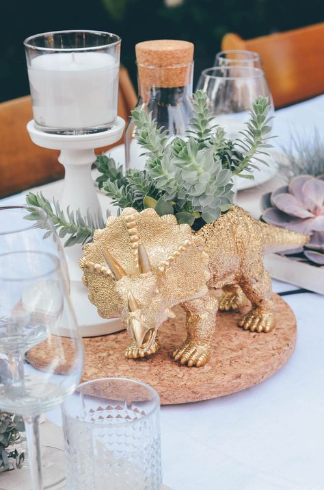 // d i n o Dinosaur Dinner Party, Unusual Baby Shower Themes, Dinosaur Centerpieces Ideas, Dinosaur Wedding Theme, Garden Bridal Shower Decorations, Dino Wedding, Dinosaur Baby Shower Ideas, Dinosaur Wedding, Girl Dinosaur Birthday