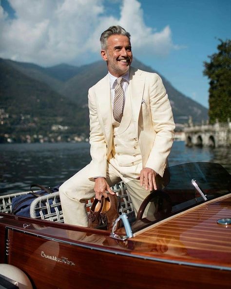 Classic gentleman enjoying his life in amazing place with classy boat! How do you like this view, classy outfit and boat combination? 😍😎👍… Summer Wedding Suit, Creme Wedding, Wedding Suit Men, Gentleman Mode, Cream Suit, Cesare Attolini, Mens Fashion Smart, White Suit, Suit Men