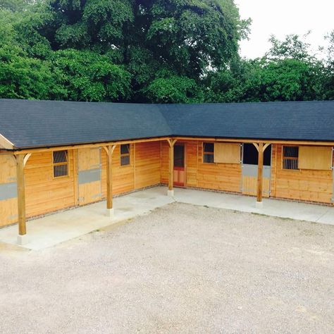 This L shape stable block includes four stables, corner office/rest room and workshop. L Shaped Stables, Livery Yard, Stable Yard, Stable Style, Stable Block, Equestrian Building, Diy Horse Barn, Stable Ideas, Horse Shelter