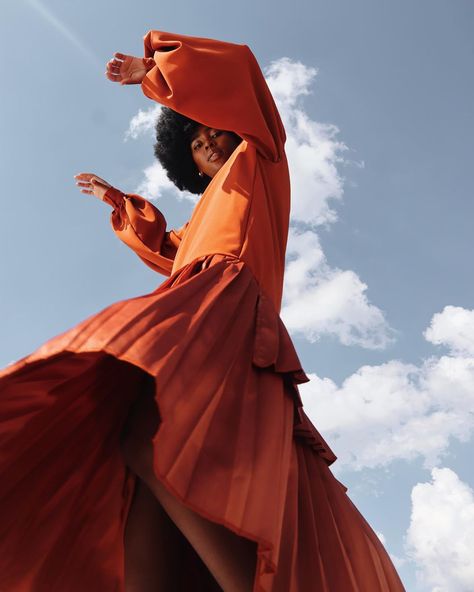 Burnt orange long length satin pleated dress with voluminous sleeves. #connade #southafricanfashion #fashion #style #womenstyle… Satin Pleated Dress, Rooftop Photoshoot, Sunday Feels, Pop Art Fashion, Fashion Model Poses, High Fashion Photography, Creative Photography Techniques, Outdoor Photoshoot, Fashion Photography Inspiration