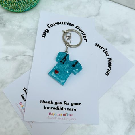 We love and appreciate our doctors and nurses. Show them some love with this keychain 💙💜 . . . #medical #medicine #doctor #nurse #healthcareworker #medicalstudent #doctorgift #nursegift #healthcareworkergifts #keychains #keyrings #resin #resinkeychains #cuteresincrafts #craft #crafting Medical Jewelry, Medicine Doctor, Care Worker, Doctor Gifts, Cute Keychain, Fun Diy Crafts, Medical Students, Fun Diy, Nurse Gifts