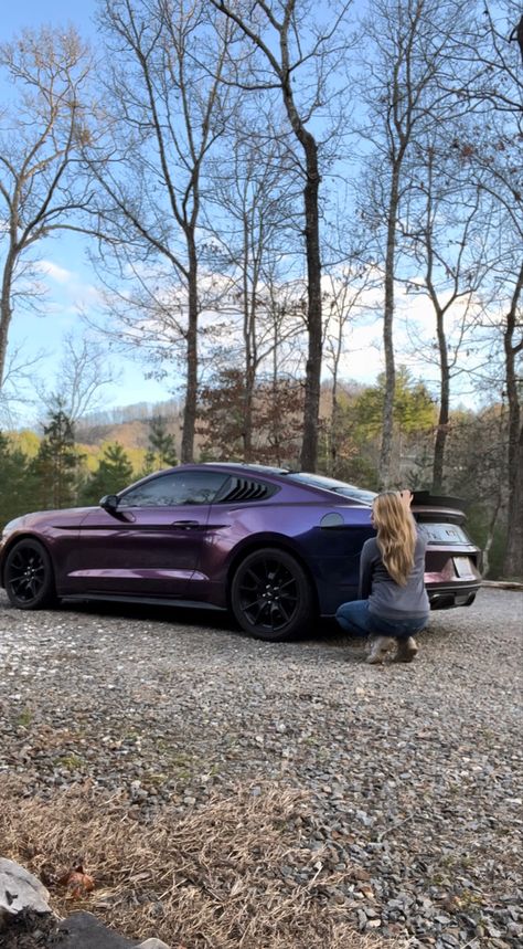 Picture is of a 20 17 mustang GT in midnight purple three wrap. Girl with sandy blond hair is squatted down near the rear part-of the car. Mountains scenery behind. Midnight Purple Vinyl Wrap, Dark Purple Mustang, Dark Purple Car Wrap, Mustang Wrap Ideas, Purple Wrapped Car, Wrapped Mustang, Midnight Purple Car, Mustang Purple, Purple Car Wrap