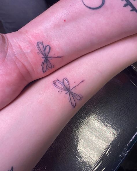 Dragonfly symbolizes wisdom, change, light and adaptability in life Tattoo Idea Mother Daughter, Two Dragon Fly Tattoo, Simple Mom Daughter Tattoos, Dragonfly Tattoo Matching, Dragonfly Tattoo On Hip, Matching Butterfly And Dragonfly Tattoo, Dragon Fly Tattoo Meaning, Mom Dragonfly Tattoo, Dragonfly Moon Tattoo