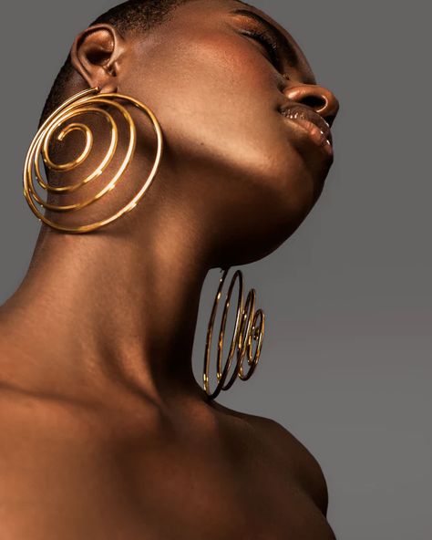 KILENTAR | TIMELESS PIECES | ARTISANAL EXCELLENCE Jewels Photoshoot, Expensive Earrings, High Fashion Earrings, Hanging On By A Thread, Shibori Dyeing, Ruffle Maxi Skirt, Shibori Dye, Spiral Earrings, African Jewelry