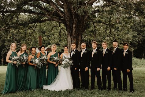 Black Suit Green Bridesmaid, Forest Green Bridesmaid And Groomsmen, Emerald Green Dress Wedding Party, Evergreen Bridesmaid Dresses With Groomsmen, Black And Green Wedding Groomsmen, Dark Green Bridesmaid Dresses With Groomsmen, Pine Color Bridesmaid Dresses, Black Tux Green Bridesmaids, Green Bridesmaids Black Groomsmen