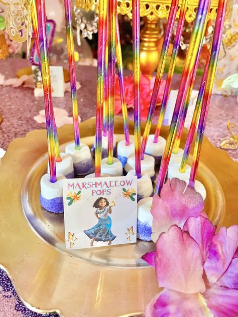 These magical Encanto party ideas are a must-see. Check out how to put together this gorgeous dessert table, where to get the decor, how to put together favor bags, and even get free printables! This Disney themed birthday party is great for girls. Encanto Cake Table, Encanto Candy Table, Encanto Table Decorations, Encanto Dessert Table Ideas, Encanto Desserts, Encanto Party Ideas, Colorful Candy Bar, Disney Themed Birthday Party, Disney Themed Birthday