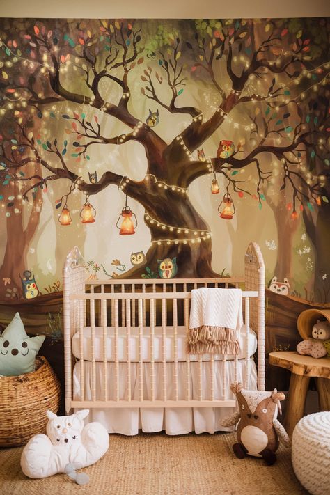 Follow the link for more adorable nursery decor ideas. 🌳 Enchant your baby's room with a whimsical woodland nursery featuring a magical tree wall mural. The sprawling tree adorned with glowing lanterns, twinkling fairy lights, and colorful leaves creates a captivating focal point. Tiny woodland creatures nestled in the branches add to the charm. Complemented by natural wood furniture and plush, earthy textures, this design transforms the nursery into an enchanting woodland wonderland. 🧚‍♀️ Whimsical Woodland Nursery, Tree Wall Mural, Woodland Wonderland, Earthy Textures, Tree Wall Murals, Natural Wood Furniture, Magical Tree, Adorable Nursery, Whimsical Woodland