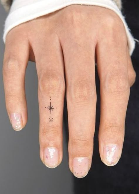 25 Beautiful and Meaningful Finger Tattoos for Women Colored Finger Tattoos For Women, Wrist And Finger Tattoos For Women, Finger Tattoo Meaningful, Symbols For Finger Tattoos, Intricate Finger Tattoo, Finger Tattoos And Meanings, Women Thumb Tattoos, Small Banjo Tattoo, Small Meaningful Finger Tattoos