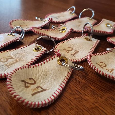 "This product is completely handmade in the USA using only professional baseballs which are deconstructed, delaced, and then hand-stitched back together using extra-thick thread.  Once completed, each keychain is hand punched and affixed with a brass rivet and steel o-ring to ensure the longevity of this conversation piece. My personal key chain is over 3 years old and is only getting better with age.  Finally, each key chain can be hand stamped with up to three numbers or letters (please specif Baseball Keychains, Baseball Bag Tags, Baseball Jewelry, Baseball Necklace, Baseball Crafts, Baseball Bag, Keychain Ideas, Thick Thread, Baseball Theme