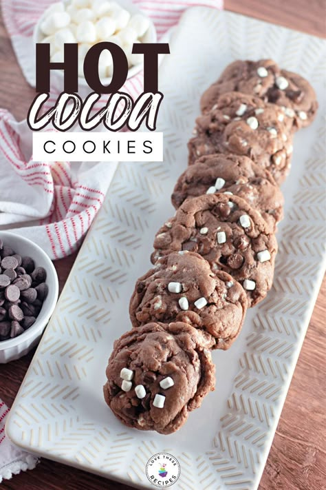 Do you enjoy drinking hot cocoa in the wintertime? If so, you'll love these hot cocoa cookies! They're easy to make and even easier to eat! Hot Cocoa Cookies Recipe, Hot Cocoa Marshmallow Cookies, Hot Chocolate And Marshmallow Cookies, Crumbl Hot Chocolate Cookies, Hot Cocoa Cookies With Marshmallows, Hot Chocolate Crumble Cookie, Hot Chocolate Cookie Recipes, Hot Cocoa Cookies, Marshmallow Cookies