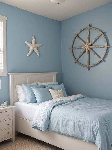 Paint one wall in a soothing blue hue to create a coastal vibe in your bedroom. Add a decorative ship wheel or starfish wall art as a focal point to enhance the seaside theme. Paint One Wall, Shark Themed Bedroom, Seashell Decorations, Underwater Bedroom, Bedroom Accent Wall, Starfish Wall Art, 2024 Bedroom, Lake House Bedroom, Easy Room Decor