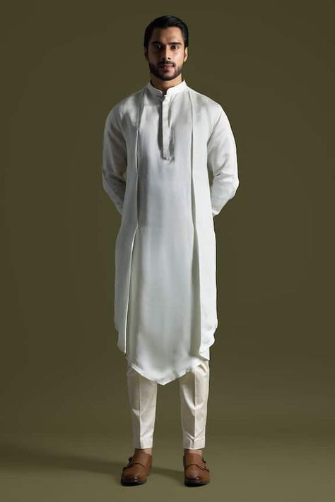 Ice blue kurta in a solid fabric base with placed symmetric drape. Comes with pant pyjama. - Aza Fashions Drape Kurta For Men, Men Kurta Designs Style 2024, Mens Designer Kurta, Silk Kurtas, Indian Wedding Clothes For Men, Kurta Pajama Men, Indian Groom Wear, Blue Kurta, Men's Kurta