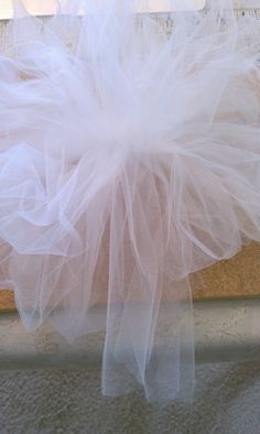 After I saw the price of tulle bows ($7.99 for one bow!), I decided to buy tulle and make them myself. I made two sizes: large bows t... Tule Bows, Tulle Wedding Decorations, Tulle Pompoms, Tulle Garland, Tulle Pew Bows, Girly Crafts, Bow Making Tutorials, Pew Bows Wedding, Pew Decorations