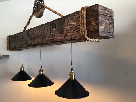 We have taken our most popular barn beam and adding some country life style for you to enjoy over your kitchen island or table. All of our barn beams are hand made to resemble those vintage beams from homes and barns of yesterday. Our beams are made hollow to lessen the weight and easy instillation. Each beam comes with a vintage style pulley and rope wrapped around each end. This light fixture comes with three or four industrial style hanging lights. All lights include 60 watt Edison style bulb Barn Beam Shelf, Barn Beam Ideas, Upstate Farmhouse, Beam Light Fixture, Barn Beam Lighting, Rustic Chandelier Farmhouse, Beam Chandelier, Varathane Stain, Rustic Light