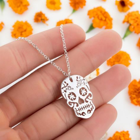 👻✨ Spooky season is here, #Fridamaniacs! Alongside our Frida-inspired jewelry, check out our Day of the Dead collection! Discover cool earrings, charms, pins, and this stunning Mexican Sugar Skull pendant charm. Limited edition and available now at www.fridamaniacs.com. Don’t miss our site-wide sale—shop now! 💀💖 Frida Kahlo Earrings, Sugar Skull Necklace, Mexican Sugar Skull, Earrings Charms, Mexican Jewelry, Skull Necklace, Skull Pendant, The Ultimate Gift, Inspired Jewelry