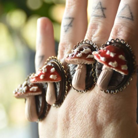 NEW! Amanita rings are now available in my webshop 🥰 These gorgeous mushroom rings resemble tiny whimsical Amanita, both the Muscaria (Red) and Pantherina (Brown) are currently available. These are a cute foresty addition to your daily outfit or fantasy costume. Each piece is handcrafted, painted and finished with varnish and UV resin. . . . #druidjewelry #paganjewelry #fairyfashion #faeriefashion #crystaljewelry #natureinspired #forestspirit #cosplay #fairyjewelry #fae #forestfairy #gobl... Nature Cosplay, Mythical Accessories, Mushroom Rings, Mushroom Accessories, Rings Clay, Mushroom Ring, Ren Fair, Fairy Jewelry, Forest Spirit