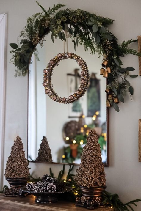 entryway with large mirror and garland over mirror Garland Over Mirror, Christmas Mirror Decorations, Entryway Mirrors, Christmas Mirror, Classic Holiday Decor, Mantle Mirror, Home On A Budget, Holiday Arrangement, Homemade Ornaments