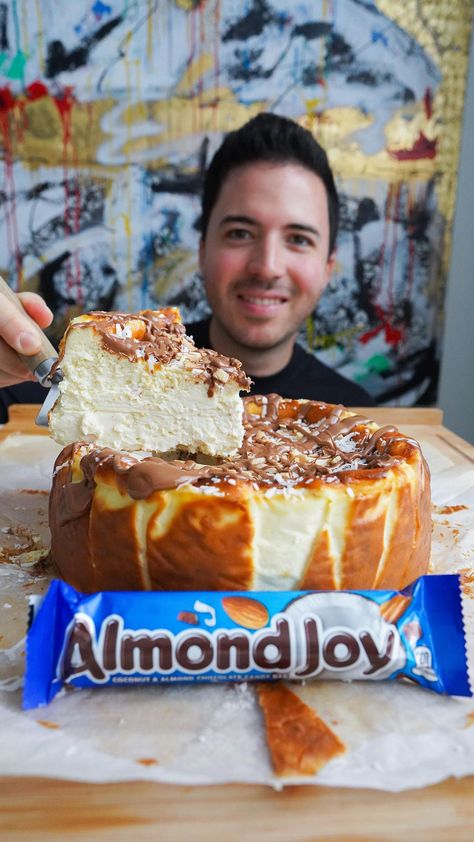 Nico Norena on Instagram: "ALMOND JOY CHEESECAKE 😍 What should the next flavor be? #succulentbite Pre-order my new recipe book! It has 60 of my favorite dessert recipes, from cheesecakes to crepes and easy ice cream! Ships worldwide on Amazon! 🔥 Check my page for link Ingredients • 40oz cream cheese (at room temp) • 1 cup granulated sugar • 1 tbsp vanilla extract • 3 eggs • 1 cup heavy cream • 1 cup coconut cream • 1/3 cup cake flour • 1/2 tsp baking powder Topping: • Shaved coconut • ... Almond Croissant Cheesecake Recipe, Heavy Cream Cake, Cheesecake Recipes No Springform Pan, Almond Joy Cheesecake Recipe, Almond Joy Cheesecake, Cheesecake No Springform Pan, Cheesecake In Springform Pan, Almond Joy Cake, Cheesecake Mix