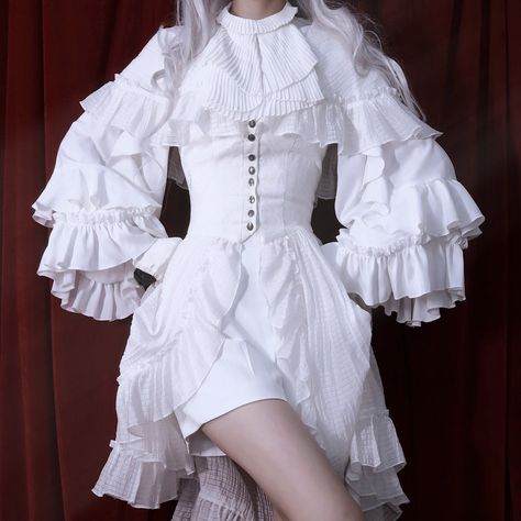 A Victorian blouse that looks like the daughter of an earl. The neck is decorated with pleats, the sleeves are decorated with flowing ruffles, and the cuffs are also decorated with pleats and ruffles. She is a gorgeous and noble young lady.               Color     White   Black       Size       S size     Length: 66cm   Shoulder width: 37.5cm   Bust: within 88cm   Waist: within 72cm   Sleeve length: 62cm     M size     Length: 67cm   Shoulder width: 38.5cm   Bust: 96cm or less     Waist: 80cm or Ruffled Blouse Outfit, Victorian Blouse, Victorian Clothing, Gothic Outfits, Blouse Outfit, Character Outfits, White Outfits, Lolita Fashion, Fancy Dresses