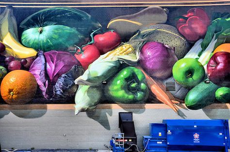 Fresh Harvest Mural on Kroger Headquarters by Jonathan Queen from ArtWorks in Cincinnati, Ohio <br /> On the side of the Kroger grocery headquarters in downtown Cincinnati, Ohio, is this delicious looking mural of vegetables and fruits called, “Fresh Harvest.”  Jonathan Queen was the lead artist.  It is another inspirational wall mural by ArtWorks, which has provided apprenticeships to a wide ethnic mix of youth from 67 schools and 75 neighborhoods. Vegetable Mural, Jonathan Queen, Food Mural, Vegetable Painting, Pumpkin Patch Sign, Garden Mural, Downtown Cincinnati, Egyptian Tattoo, Murals Street Art