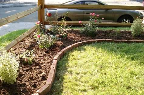 corner lot landscaping ideas | and this is how it looked after a hard winter with way too much snow: Corner Landscaping, Landscaping Trees, Front Yard Fence, Landscaping Garden, Front Landscaping, Fence Landscaping, Brick Patios, Diy Yard, Front Yard Garden