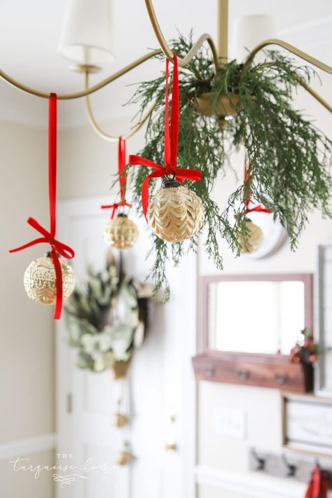 Gold ornaments hanging from chandelier with red velvet ribbon. Christmas Chandelier, Christmas Wired Ribbon, Tree Inspiration, Grey Christmas, Ribbon On Christmas Tree, Christmas Inspo, Valentine Day Wreaths, Gold Ornaments, Christmas Ribbon