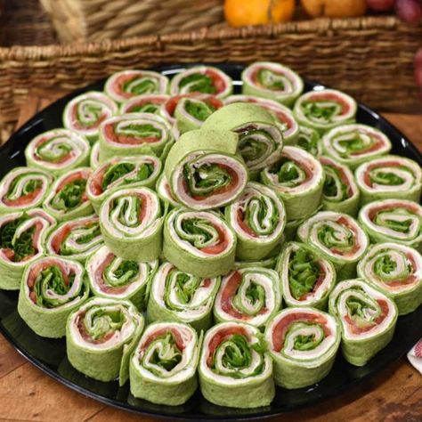 Product Description Turkey pinwheel platter: featuring Boar’s Head turkey, cream cheese, green leaf lettuce, tomato in a tortilla wrap. Our Turkey Pinwheel appetizer platters are handmade to order with fresh ingredients and care. Medium platters serve 8-12 people Large platters serve 15-20 people Price: $40.00 – $70.00 Steak Fondue, Veggies Illustration, St Patrick Party Food, Pinwheel Appetizer, St Patrick's Day Appetizers, St Patricks Food, Green Leaf Lettuce, St Patrick Day Snacks, Turkey Pinwheels