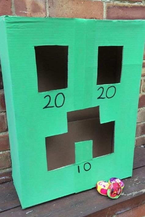 Another amusing Minecraft party activity that is simple to set up is a Creeper bean bag toss. Paint a cardboard box green and cut out the eyes and mouth to make it a Creeper Place a couple of bean bags next to the Creeper and have your guests win points by aiming for each hole. Minecraft Sensory Bin, Dollar Tree Minecraft Party, Minecraft Party Crafts, Minecraft Party Games Activities, Minecraft Diy Party Decorations, Minecraft Pizza, Tee Shirt Painting, Minecraft Party Bags, Creeper Pinata