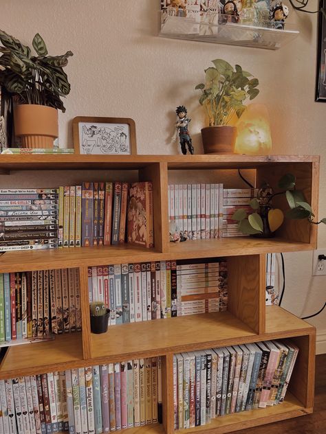 Bedroom Bookshelves Ideas, Anime Shelves Aesthetic, Manga Shelf Ideas, Japanese Bookshelf Aesthetic, Manga Shelf Aesthetic, Manga Bookshelf Aesthetic, Studio Ghibli Books Aesthetic, Manga Collection Room Aesthetic, Geek Chic Decor