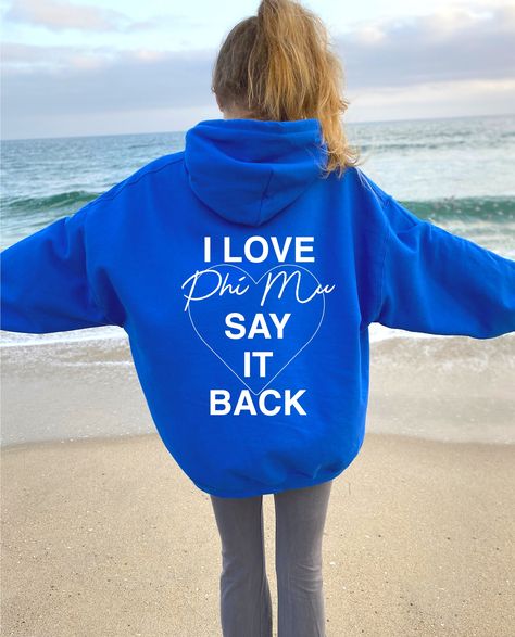 I Love Phi Mu Say It Back Sorority Hoodie. Available in White, Black, Light Blue, Royal, and Light Pink -- just select your desired color using the dropdown menu! This listing is for PHI MU. We offer our designs for 26 different sororities, to find yours use our search bar or menu located on our shop. Return Policy: We do not offer returns as our items are custom made-to-order, made specifically for you! If you need help determining your size, please feel free to send us a DM. ♥ SIZING ♥ Unisex Vsco Hoodie, Sorority Sweatshirts, Big Little Gifts, Alpha Xi Delta, Alpha Sigma Alpha, Alpha Chi Omega, Custom Hoodie, Delta Gamma, Delta Zeta