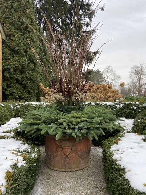 garden sculpture | Deborah Silver & Co. Yellow Twig Dogwood, Red Twig Dogwood, Deborah Silver, Twig Dogwood, Plastic Grass, Dogwood Branches, Magnolia Branch, Winter Arrangements, Winter Planter