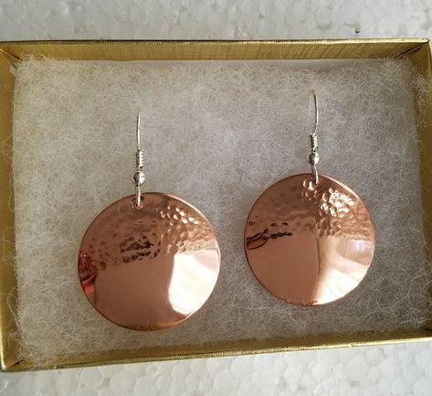 Hammered solid copper earrings on sterling silver ear wires. I hammered only the top half of the copper disc which is domed slightly. Available in two sizes, medium,1 inch in diameter, and large,1&1/2 inches in diameter. I also have these in a completely hammered version listed. Shipped in a gift box to protect during shipment. Hammered Metal Earrings, Copper Jewellery Handmade, Copper Earrings Handmade Ideas, Metal Earrings Handmade, Copper Bowls, Hammered Metal Jewelry, Copper Jewelry Diy, Copper Earrings Handmade, Handmade Copper Jewelry