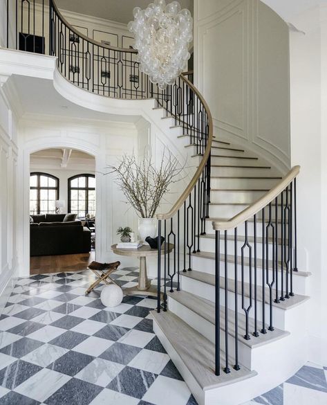 In awe of this timeless hallway; those monochrome marble piano tiles are just 🫶🏼🫶🏼🫶🏼      📸credit:  Designed by @noblestudio_interiors Constructed by @kennonconstruction Photographer @juliawade Styling: @gthr.d 👏🏼🫶🏼 ___________________  Follow @britishhomedesign for daily inspiration.  • BHD is a multi-award winning, Norfolk based, Architecture & Interior Design Studio tagging inspirational home design with our label of approval • ___________________ Talia Chandelier, Foyer Renovation, Marble Staircase, Stair Rail, Stairway Design, Curved Staircase, Glass Balls, Railing Design, Marble Floor