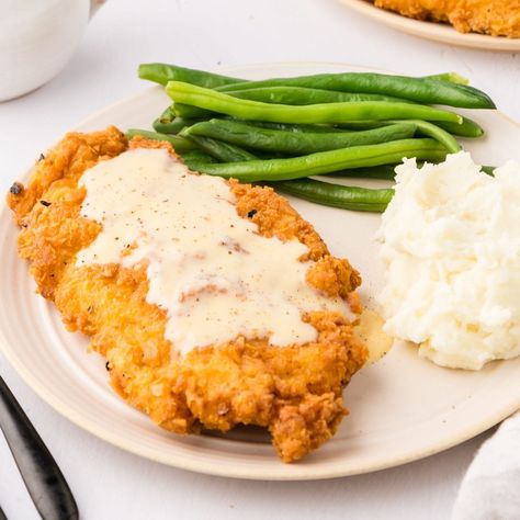 Few dishes are more iconically southern, comforting, or downright delicious than Chicken Fried Chicken With Gravy! Chicken Fried Chicken With Gravy, Fried Chicken With Gravy, Chicken With Gravy, Chicken Fried Chicken, Chicken Milk, Gravy Ingredients, Fried Chicken Breast, Saltine Crackers, Chicken Fried