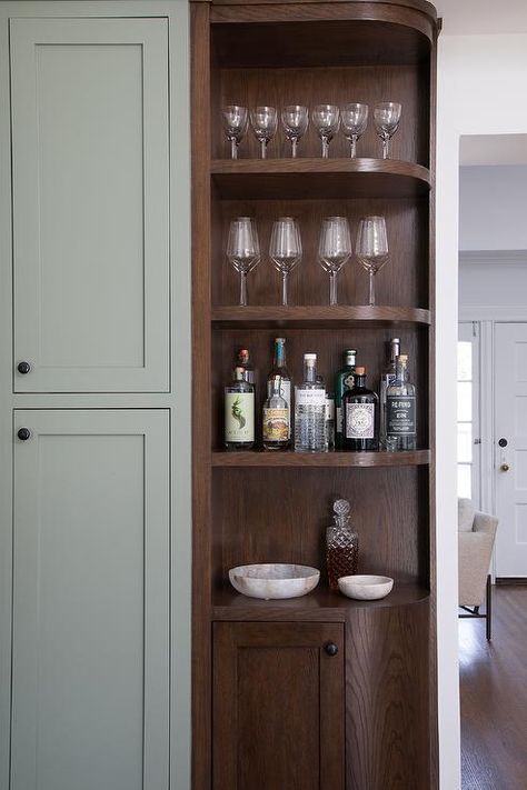 Corner rounded bar cabinet features built in shelving. Built In Bar Cabinet, Kitchen Corner Shelves, Gray Tile Backsplash, Pull Out Spice Rack, Newly Remodeled Kitchens, Corner Bar, Grey Backsplash, Built In Bar, White Quartz Countertop