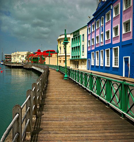 Barbados Boardwalk....Barbados, one of Brother and Sister Brown's Honeymoon stops. Barbados Honeymoon, Barbados Vacation, Board Walk, Barbados Travel, Bridgetown Barbados, Colorful Buildings, Bridgetown, Caribbean Travel, Caribbean Island